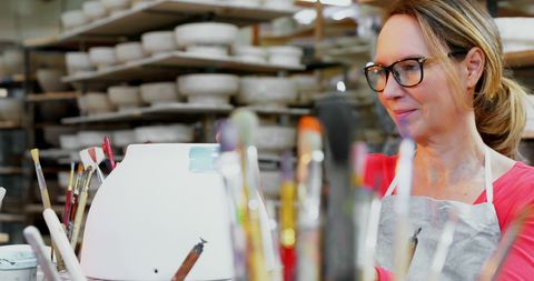 Artist Painting Pottery in Creative Studio Environment - Download Free Stock Images Pikwizard.com