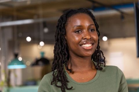 African american professional smiling and looking right in modern coworking headshot