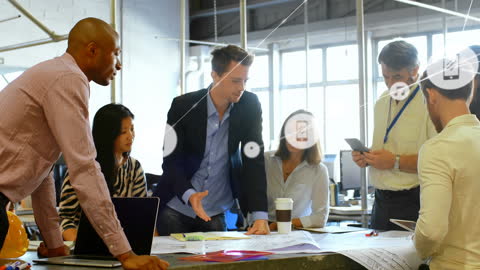 Team Collaborating Over Blueprints with Digital Interface Overlay