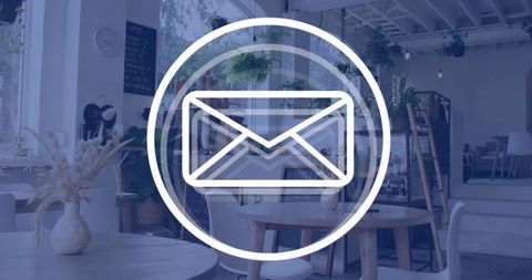 Envelope icon overlaying cozy cafe interior showing wooden tables, green plants and rustic lighting