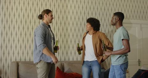 Friends Celebrating at Home with Beers and Laughter