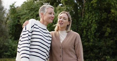 Intergenerational conversation in garden sharing support and companionship between women