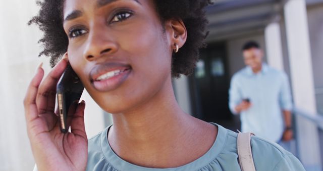 African American Woman Talking on Phone in Outdoor Urban Setting - Download Free Stock Images Pikwizard.com