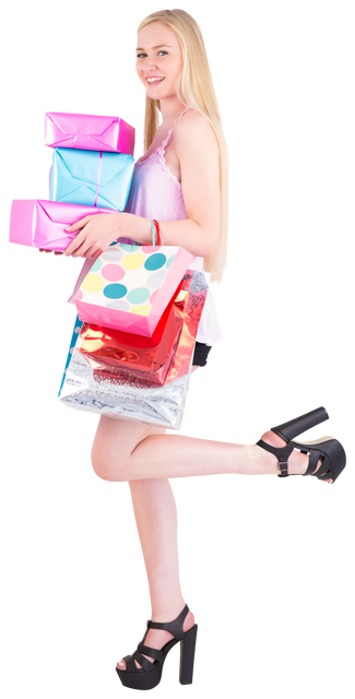 young blonde woman holding shopping bags and vibrant gifts transparent background - Download Free Stock Videos Pikwizard.com