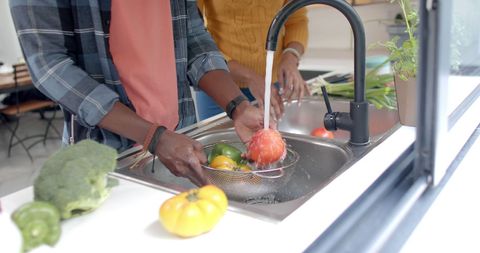 Couple Washing Fresh Vegetables in Modern Kitchen - Download Free Stock Images Pikwizard.com