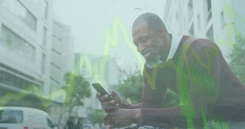 Smiling Man Using Smartphone with Overlay of Statistical Data