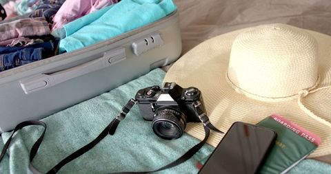 Preparing for Travel with Packed Suitcase and Essentials - Download Free Stock Images Pikwizard.com