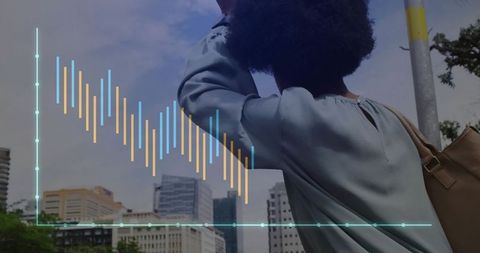 African American Woman with Financial Graph Overlay Street Scene