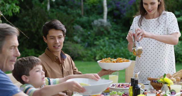 Family Enjoying Outdoor Garden Dinner Gathering - Download Free Stock Images Pikwizard.com