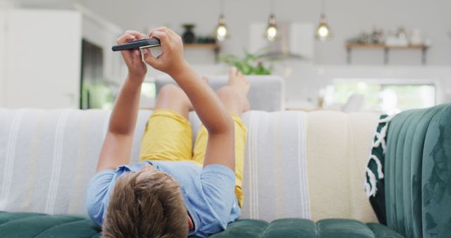 Young Boy Relaxing at Home Using Smartphone - Download Free Stock Images Pikwizard.com