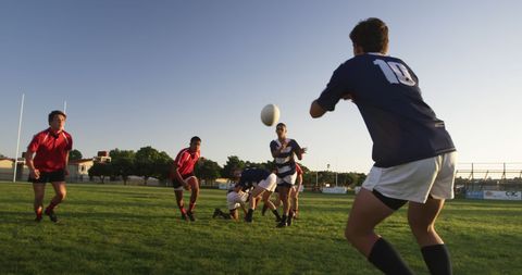 Youth Rugby Teams Playing Match on Sunny Field