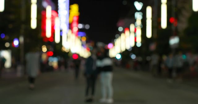 Defocused City Street at Night with Bright Lights and Walking People - Download Free Stock Images Pikwizard.com