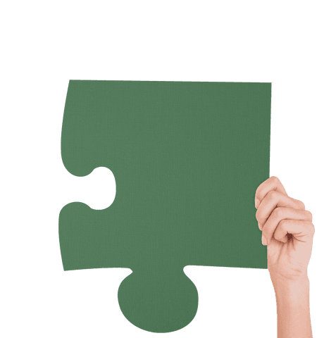 Hand holding green puzzle piece on transparent background