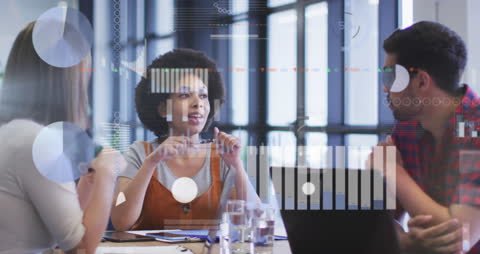 Diverse Team Analyzing Data at Office Meeting