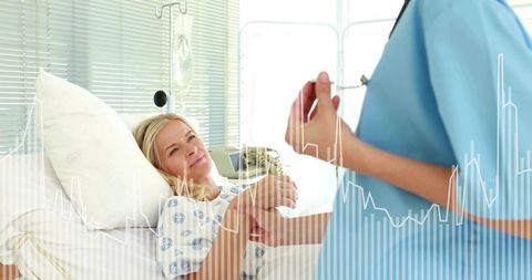 Nurse Checking Patient Pulse at Bedside with IV Drip Providing Compassionate Hospital Care