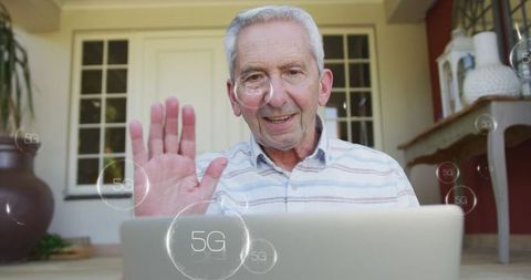 Senior Man Using Laptop with Digital 5G Interface
