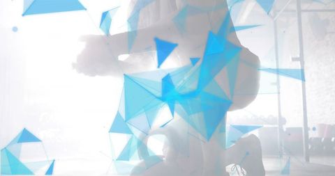 Backlit fitness duo performing squats with abstract blue geometric overlay silhouette haze