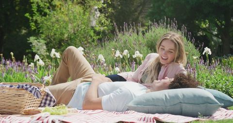 Couple Enjoying Romantic Picnic Among Colorful Flowers - Download Free Stock Images Pikwizard.com
