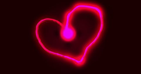 Glowing Pink Heart Light Trail Illuminates Darkness