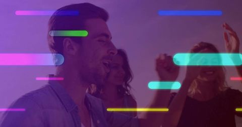 Celebrating Friends Dancing Under Neon Lights