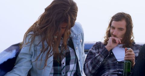 Young Couple Relaxing Outdoors with Scenic View