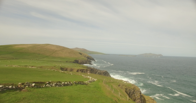 Serene Landscape of Cliffs by Transparent Ocean Under Clear Sky - Download Free Stock Videos Pikwizard.com