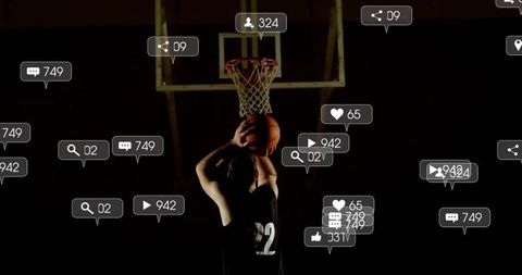Basketball player shooting under spotlight with social media notification overlays icons
