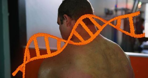 Male athlete standing in gym with orange dna helix overlay tracking fitness genetics