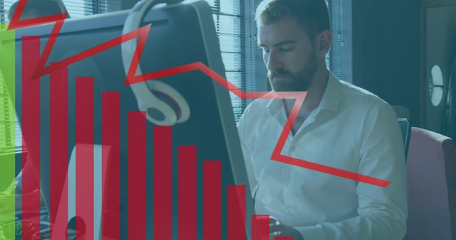 Image of financial graphs and data over caucasian man using computer in office. Business, finance and economy concept digitally generated image.