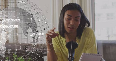 Influencer recording vlog with digital global overlay