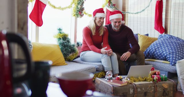 Couple Celebrating Christmas Together with Virtual Call, Laptop on Table - Download Free Stock Images Pikwizard.com