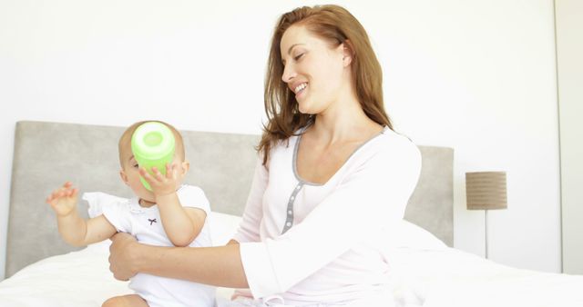 Mother Drinking Coffee While Holding Baby - Download Free Stock Images Pikwizard.com