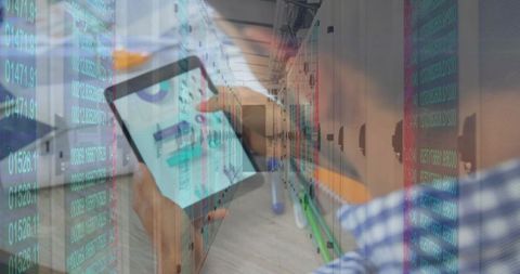 It technician holding tablet in datacenter with digital code overlay and server racks