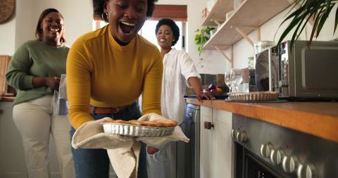 Women Enjoying Baking Activity in Modern Kitchen