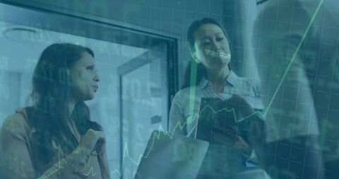Women analyzing data on laptop with financial projections overlay