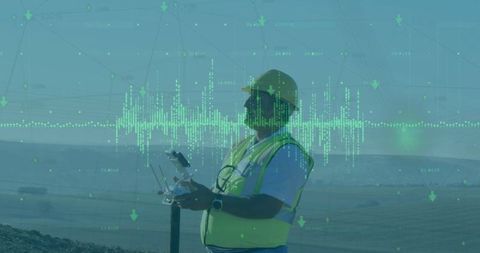 Engineer piloting drone on rocky terrain with telemetry display