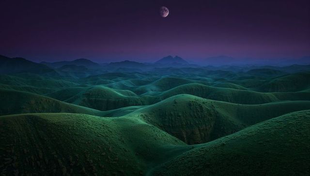 Enchanted Moonlit Hills under Dusky Sky
