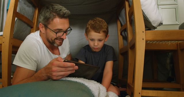 Father and Son Building Blanket Fort and Using Tablet - Download Free Stock Images Pikwizard.com