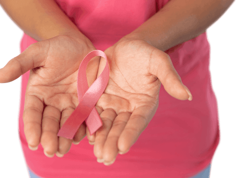 Close-up of woman holding pink ribbon for breast cancer awareness