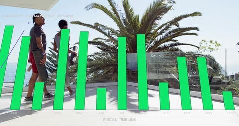Active couple walking on coastal terrace with ocean view and green chart overlay