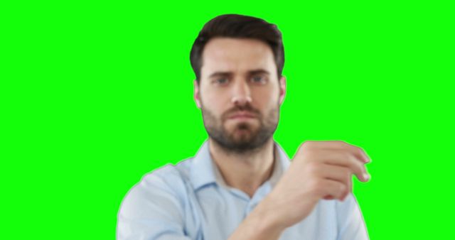 Confident Man Pointing with Green Screen Background - Download Free Stock Images Pikwizard.com
