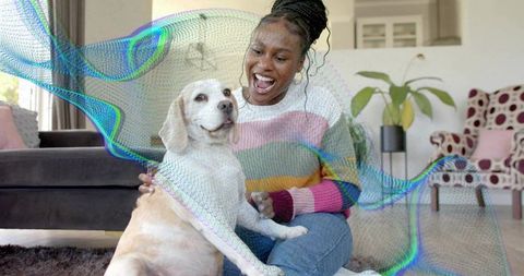 Joyful Woman and Her Dog Enjoying Cozy Home Moments