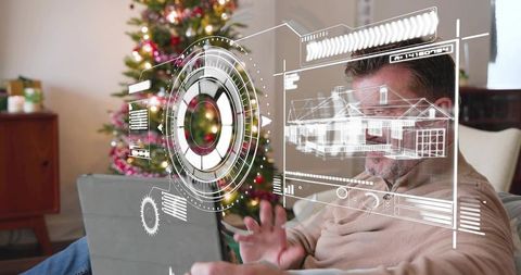 Mature man interacting with augmented reality home blueprint in cozy christmas living room