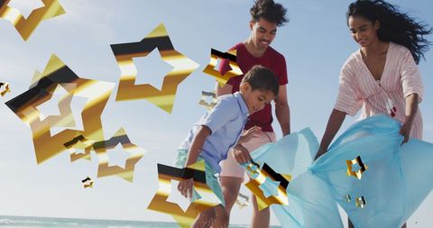 a family participating in a beach clean up depicted with animated golden stars overlay creates a festive atmosphere blending the themes of christmas and environmental sustainability. ideal for promoting eco-friendly activities, holiday clean-ups, or digital multimedia projects that focus on family involvement and celebration with an innovative artistic touch.