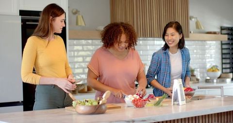Diverse Friends Cooking Together in Spacious Modern Kitchen