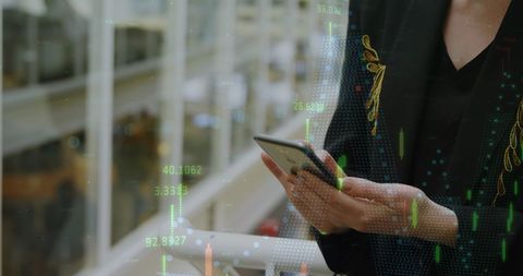 Businesswoman Analyzing Digital Data with Smartphone in Modern Office