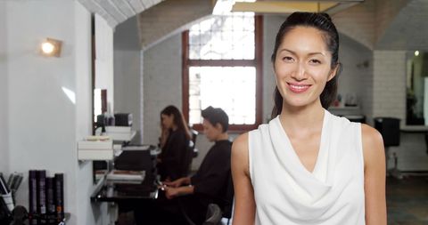 Confident Asian Businesswoman in Modern Office Scene