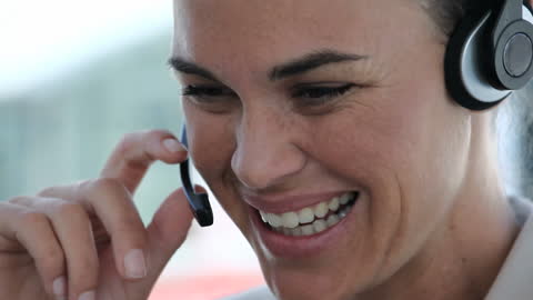 Smiling Businesswoman Communicating via Headset