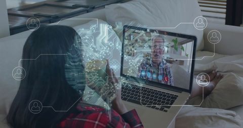 Woman Video Calling Using Laptop with Digital Interface Overlay
