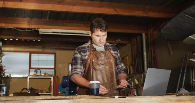 Carpenter Using Laptop and Tablet in Workshop - Download Free Stock Images Pikwizard.com